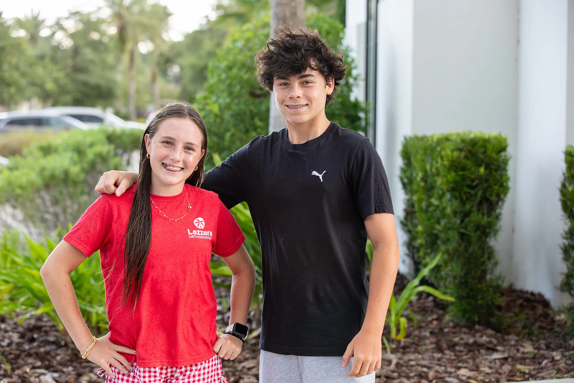 happy teen siblings with braces