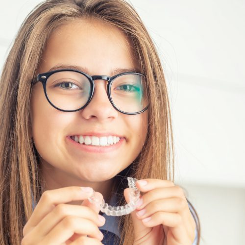 Young girl with dental invisible braces. Young girl with dental invisible braces.